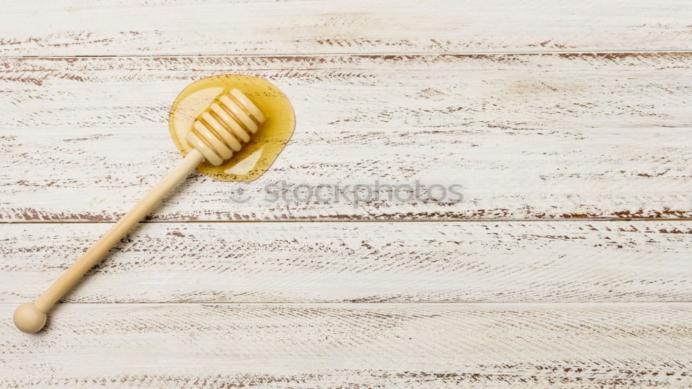 Similar – Honey and honey dipper on white marble