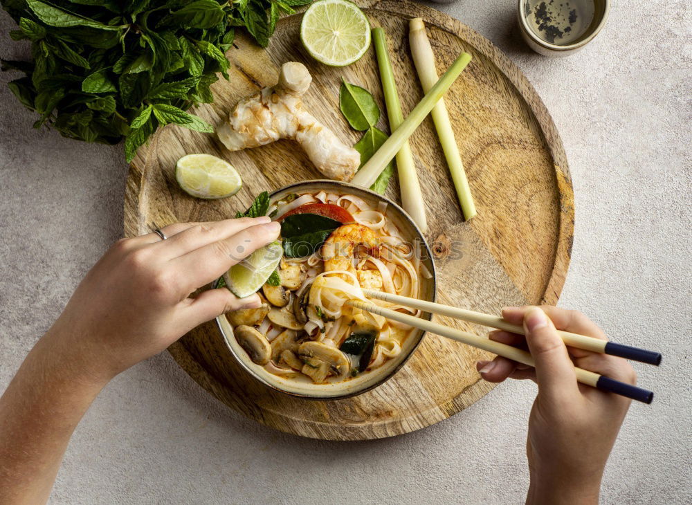 Similar – Geometric bowl of Asian Noodle Soup with chopsticks