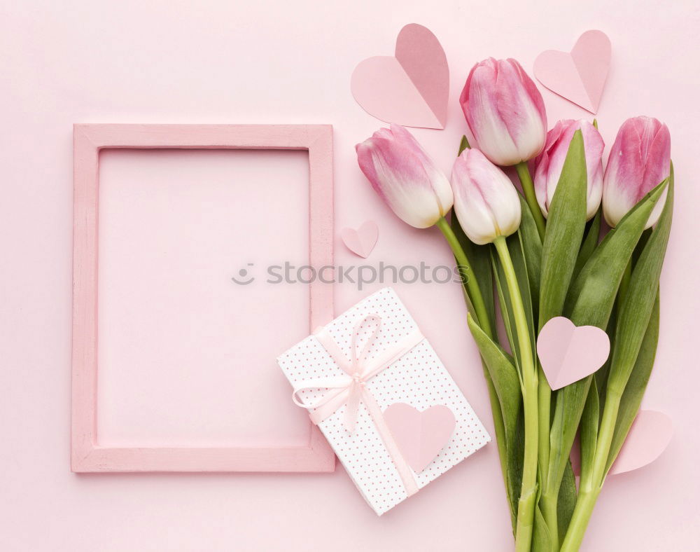 Similar – Table with cup of coffee, gift and pink tulips