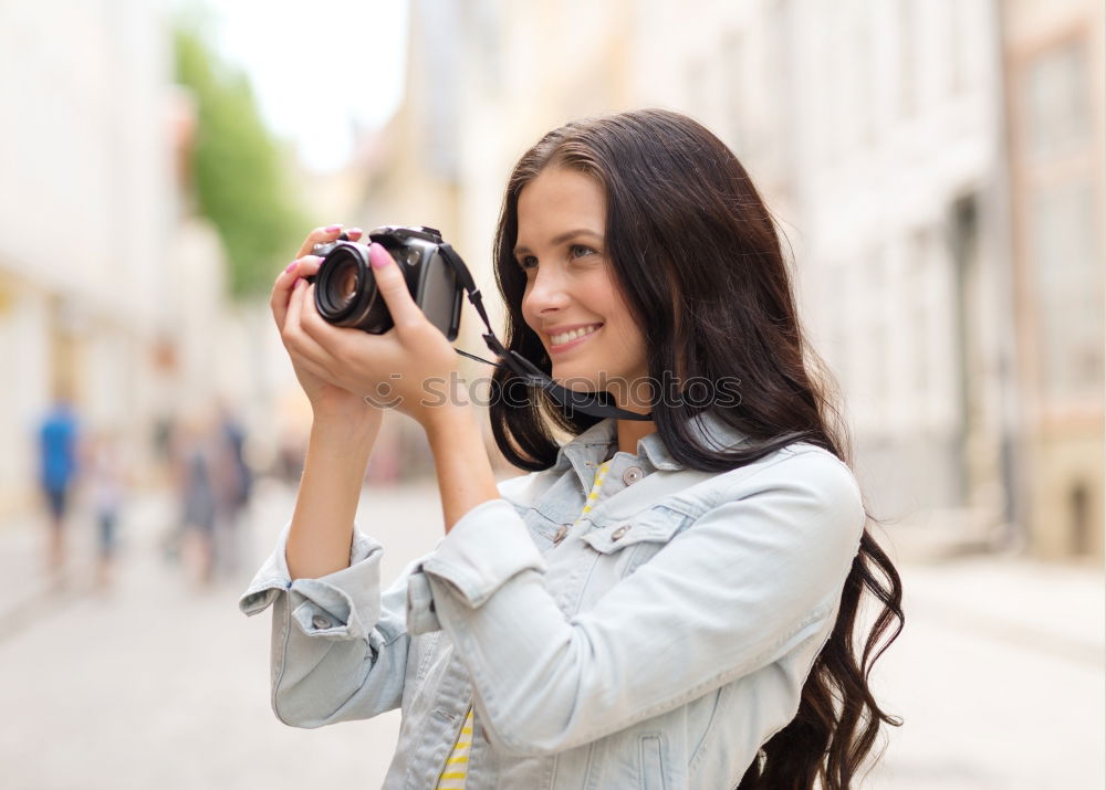 Similar – Image, Stock Photo Young woman using a camera to take photo.