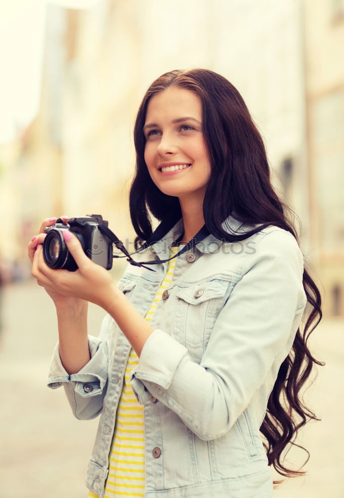 Similar – Image, Stock Photo Young woman using a camera to take photo.