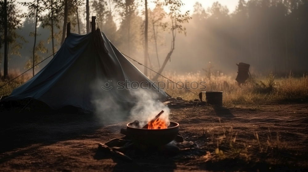 Similar – Man lights a fire in the fireplace in nature at night