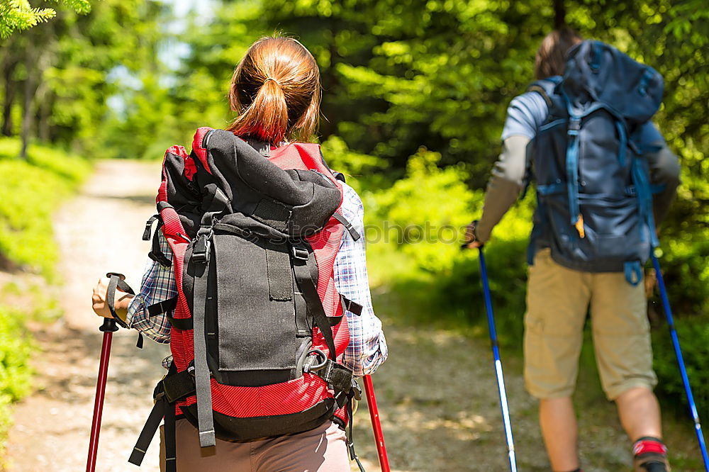 Similar – Woman doing trekking looking at camera