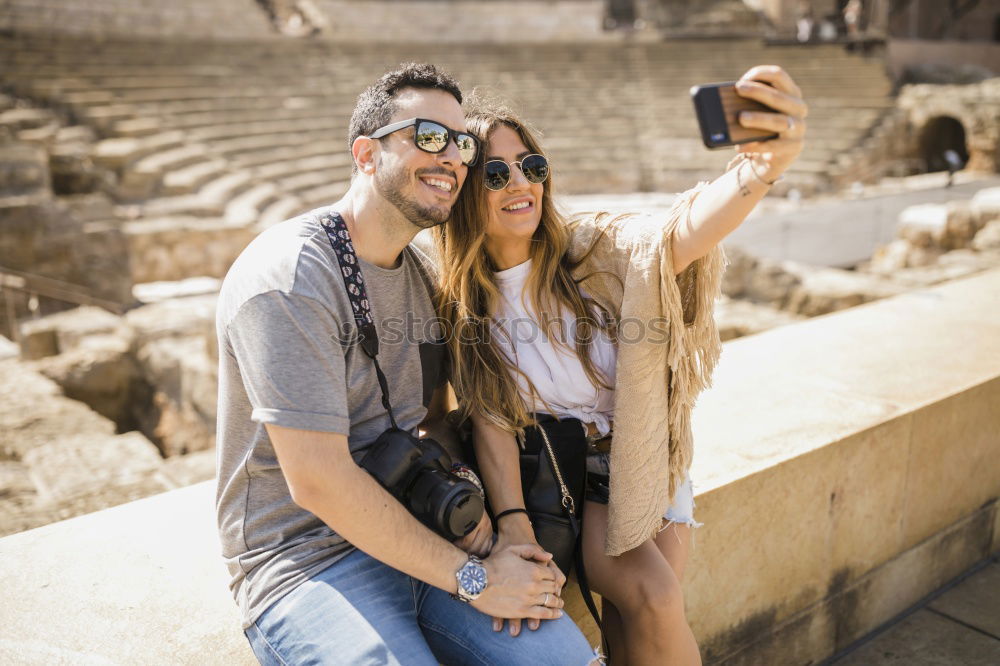 Similar – Image, Stock Photo Cheerful friends taking photos of themselves on smart phone