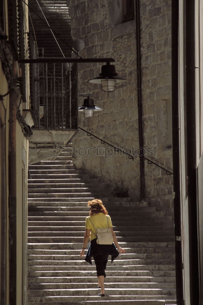 Similar – Image, Stock Photo Woman in a small alley in Naples with a view of the city