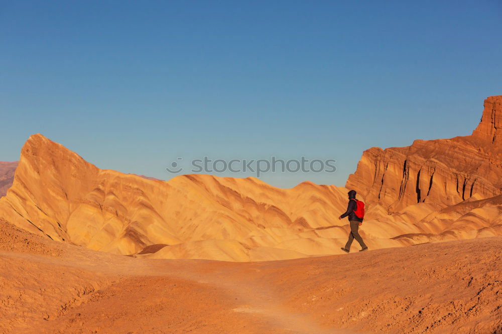 Similar – Hiker in the desert.