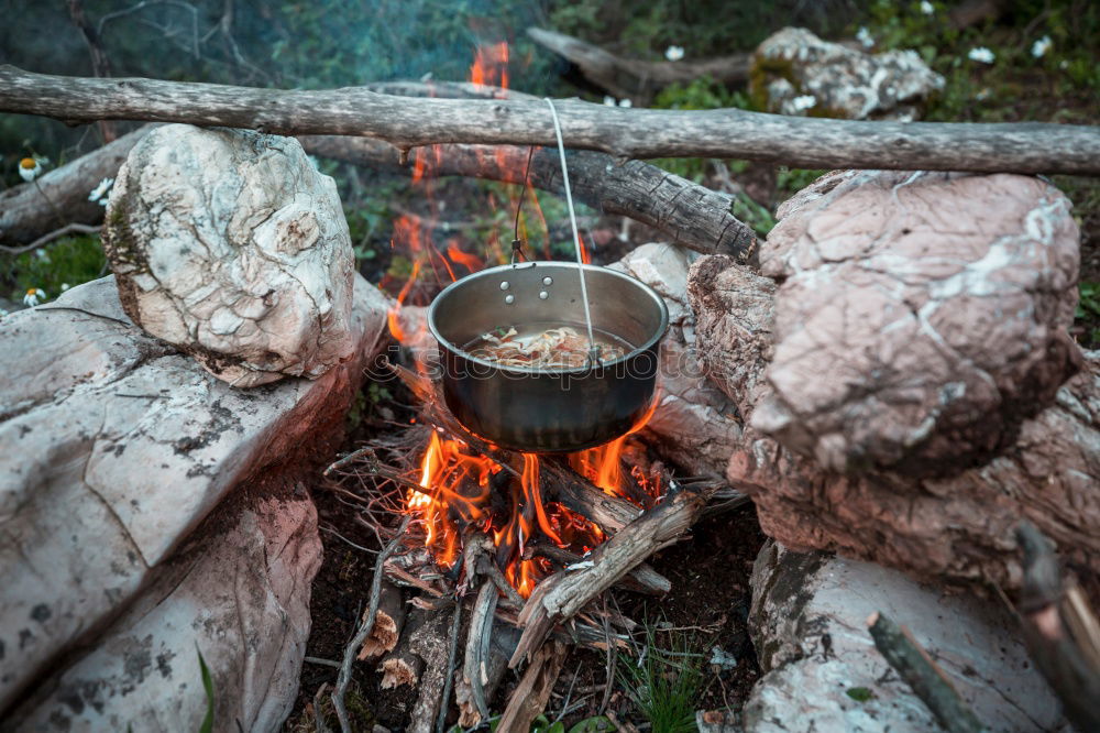 Similar – Making coffee on campfire