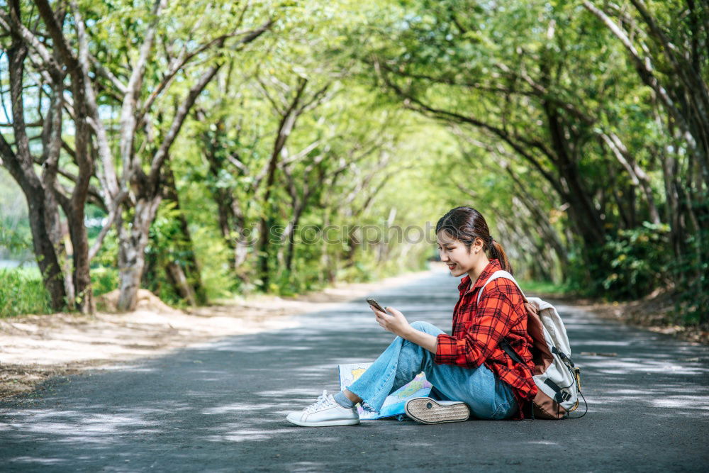 Similar – Image, Stock Photo Woman skateboarder listening music from smart phone in a park