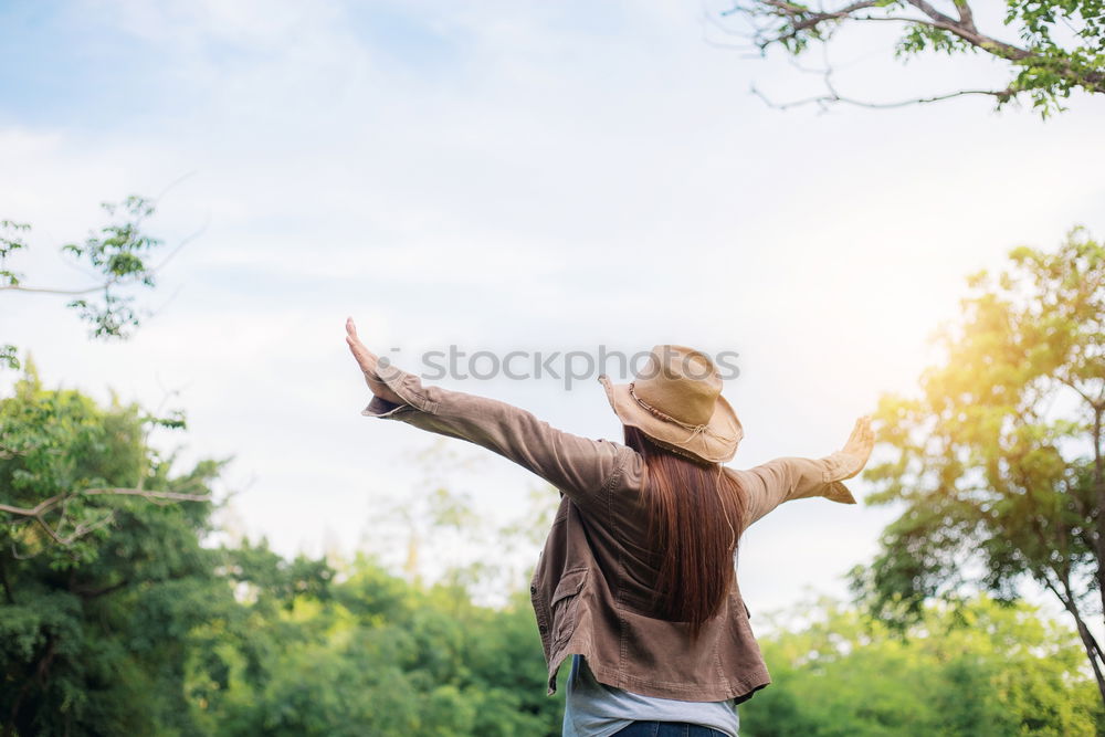 Similar – Image, Stock Photo A women with a bottle in her hand looks at the landscape