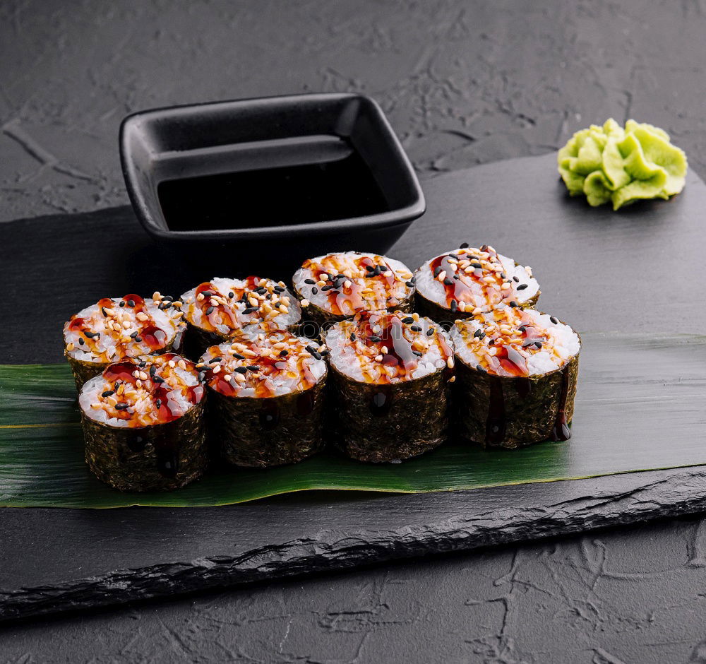 Similar – Female chef placing japanese sushi rolls on a tray