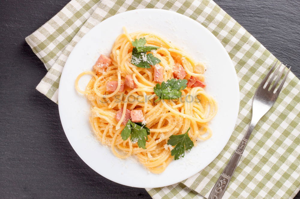 Similar – Spaghetti Carbonara in a green plate