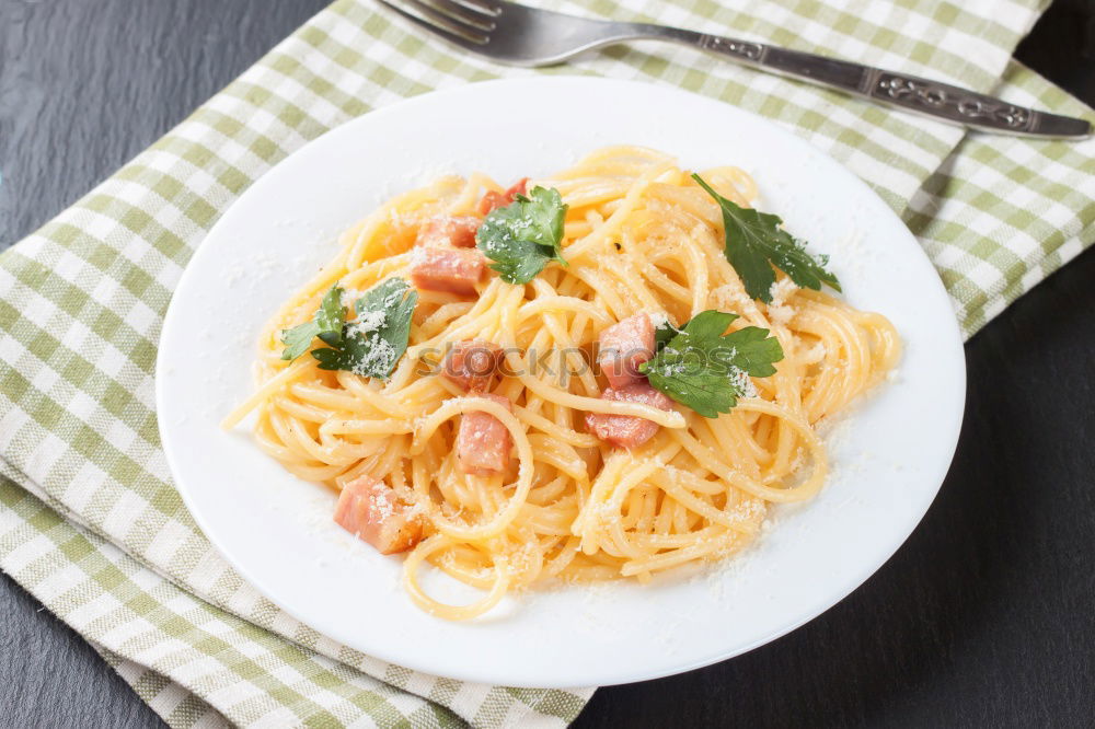 Similar – Spaghetti Carbonara in a green plate