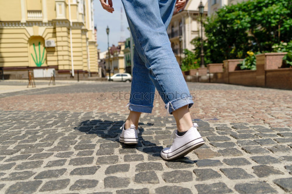 Similar – Image, Stock Photo Back view rear view of a woman holding shopping bags while wearing cool style cloths. Jeans and a top. Shopping street. Changing and buying gifts concept.