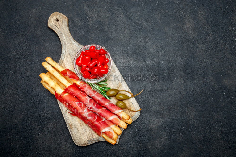 Similar – Pickled herrings with slices of bread and onion sauce