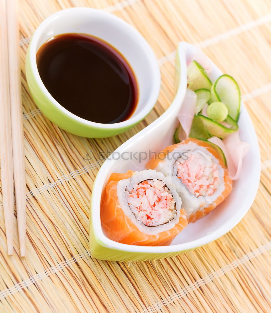 Similar – Image, Stock Photo Sushi set on pottery plate with chopsticks and soy sauce