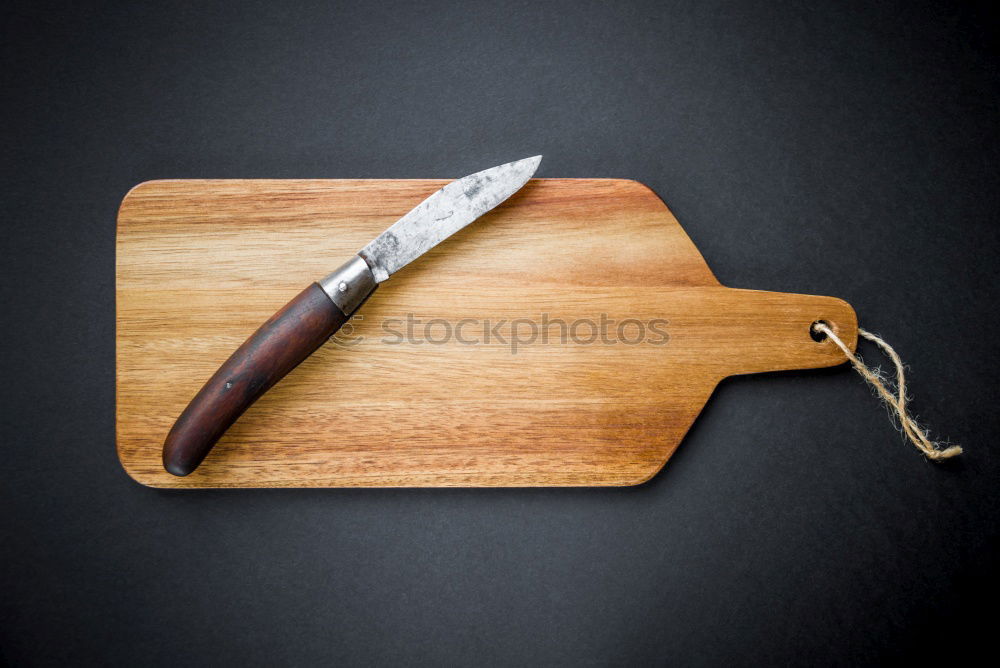 Similar – empty old brown wooden cutting board and knife