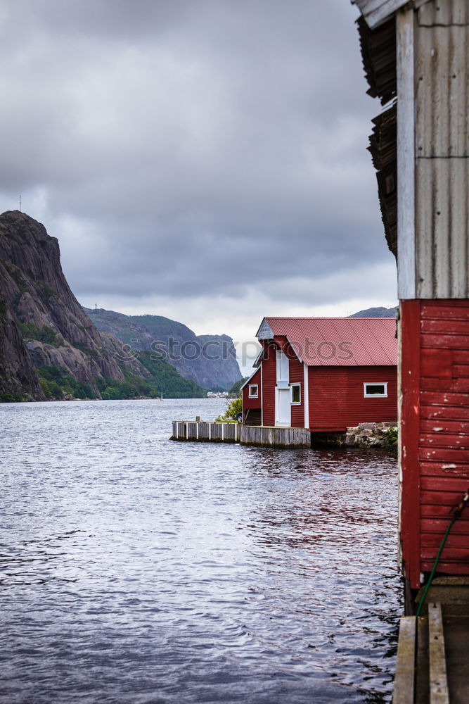 Similar – Small houses on lakeside in mountains