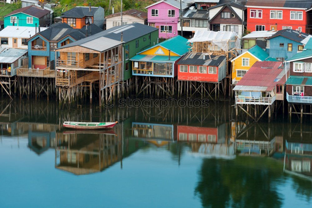 Similar – Colorful houses on piles