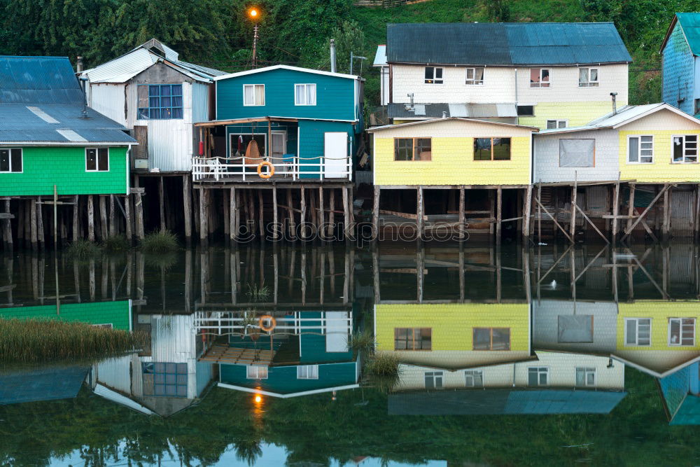 Similar – Colorful houses on piles