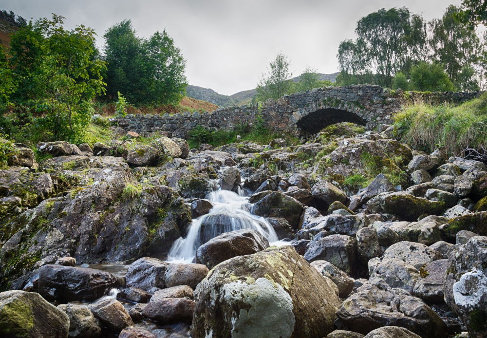 Similar – Woman sitting on a stone bridge in Dartmoor, England