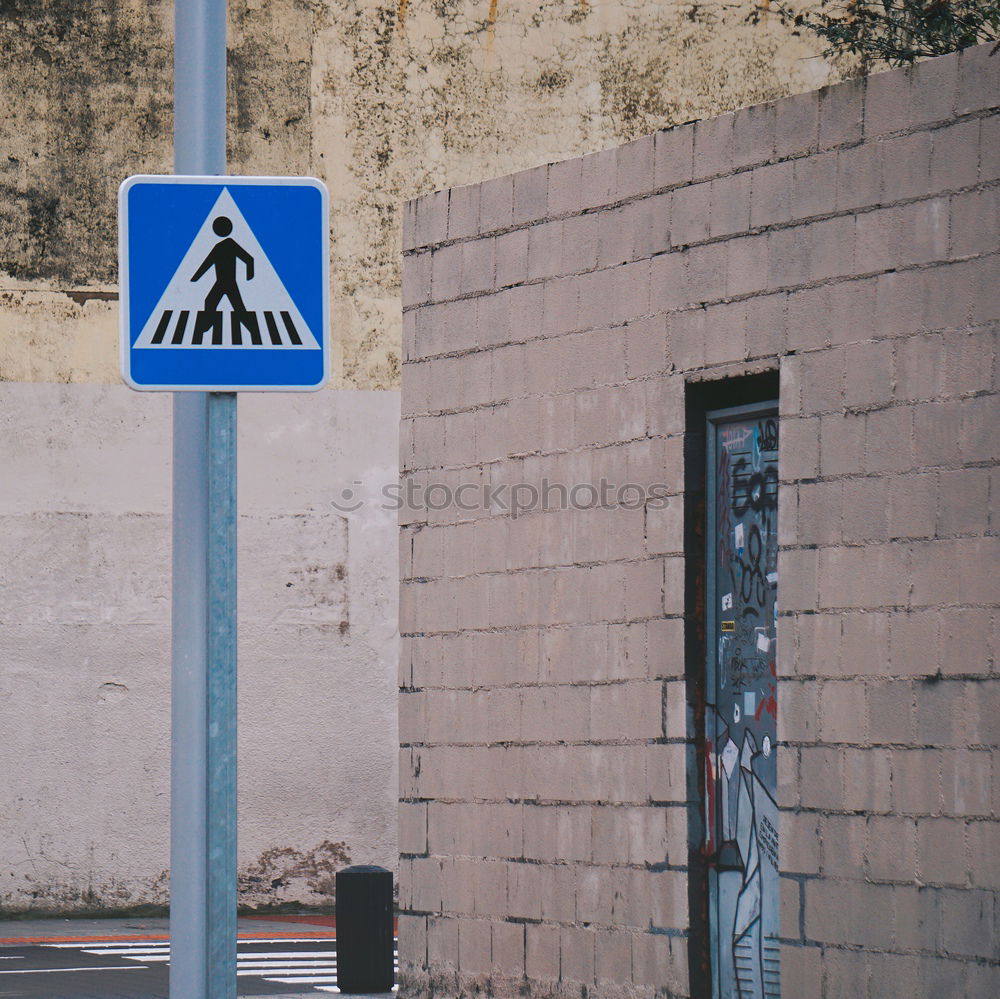 Similar – red sprayed warning sign about clearance height on barge in front of construction fence and bushes.