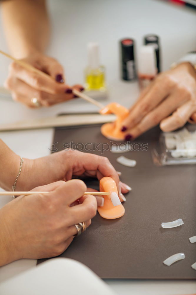 Similar – Close up on woman’s hands sewing needle and thread. Old woman working wasted hands .Tailor sewing some fabric. Details, low light, moody