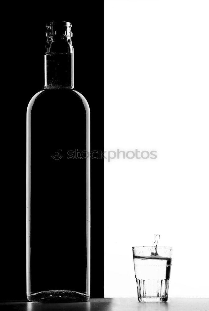 Similar – Breakfast is ready, said the alcoholic. Liquor bottle on a wooden table