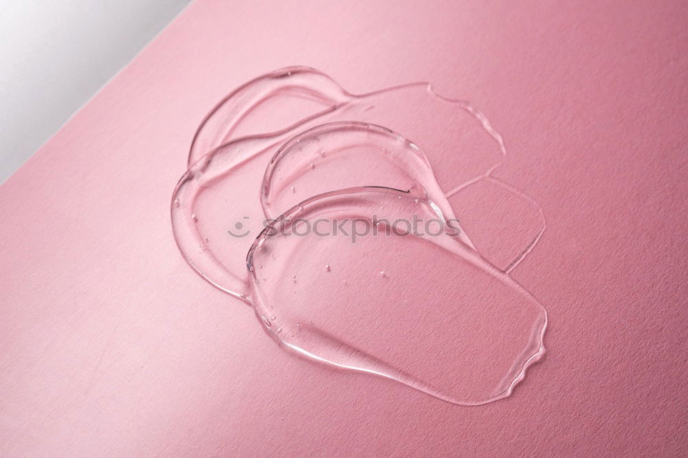 Similar – Paper scroll with ribbon on pink background