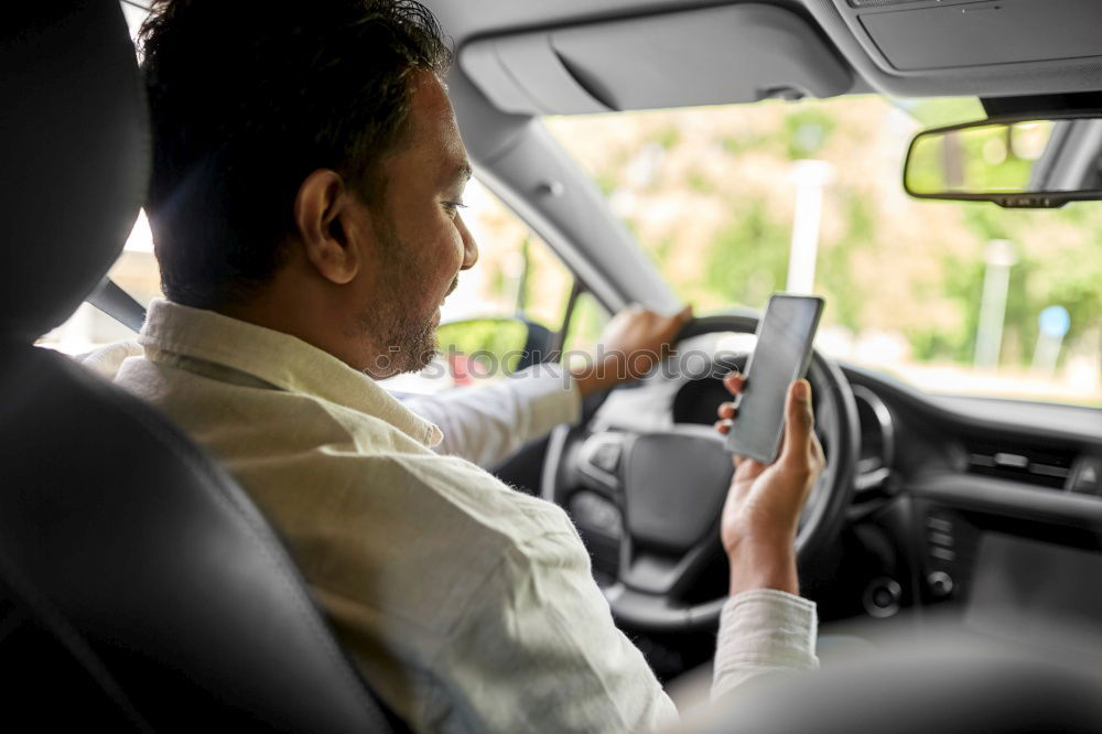 Similar – Image, Stock Photo Young man holding steering driving