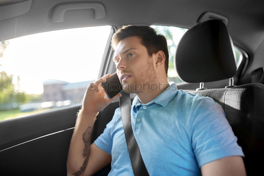 Similar – Taxi driver in a mask with a client on the back seat wearing mask