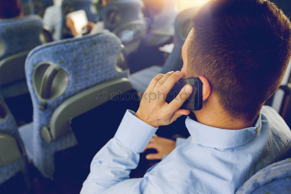 Similar – Man listening music in train