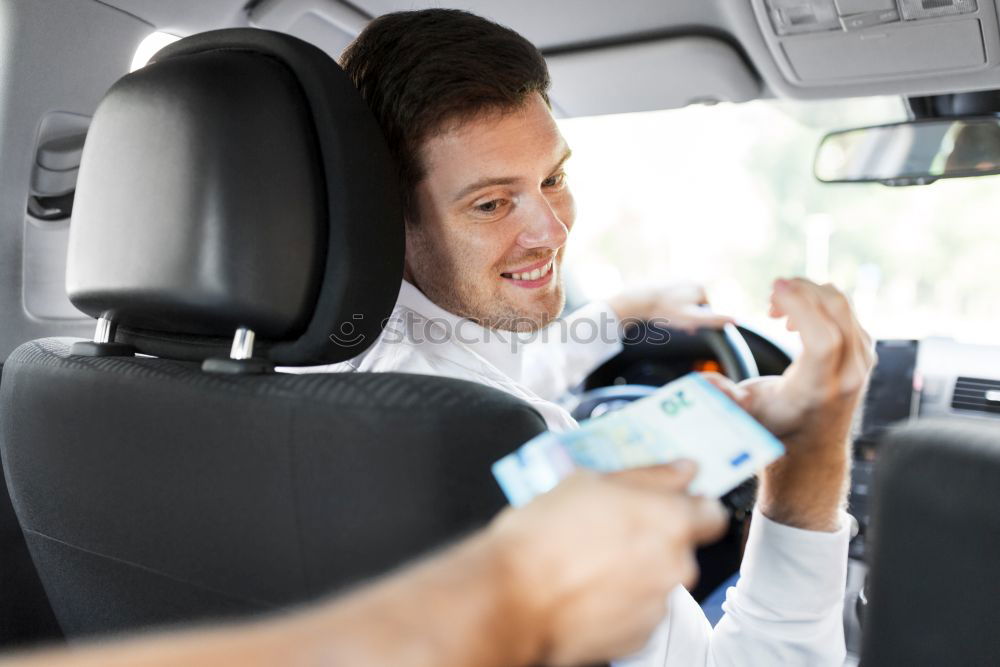 Similar – Taxi driver in a mask with a client on the back seat wearing mask