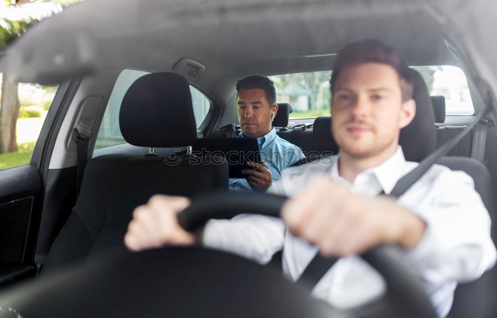 Similar – Taxi driver in a mask with a client on the back seat wearing mask