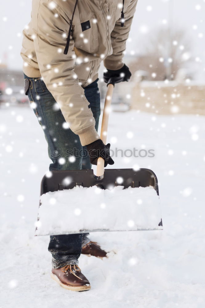 Similar – A woman pulls a sled through the snow. Winter atmosphere.