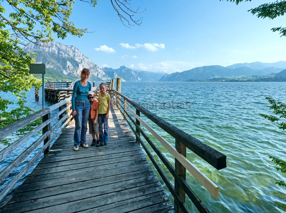 Similar – Image, Stock Photo Woman looking at hills on lake