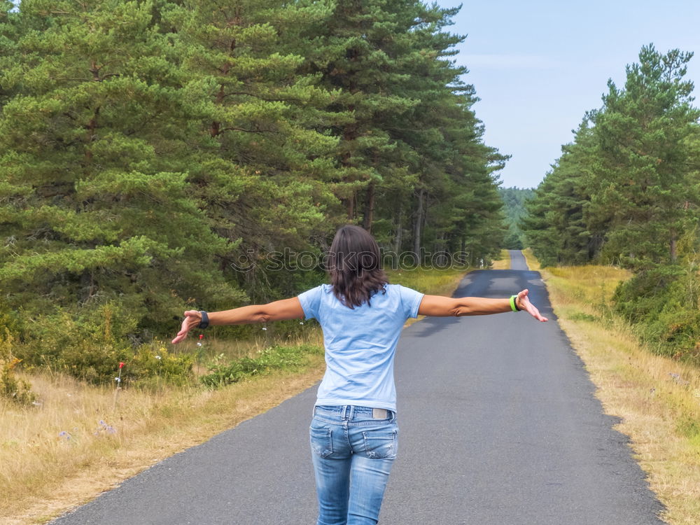 Similar – Hiker in forest with hands up