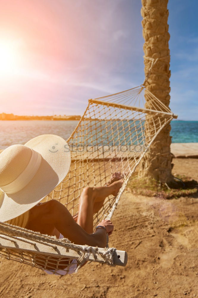 Similar – Image, Stock Photo Towel, beach ball, sunscreen and water gun on the beach