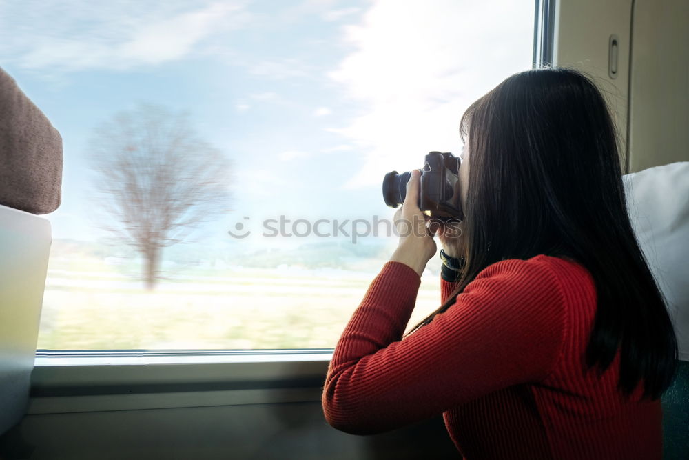 Similar – Image, Stock Photo Toddler looks curiously out of the train window