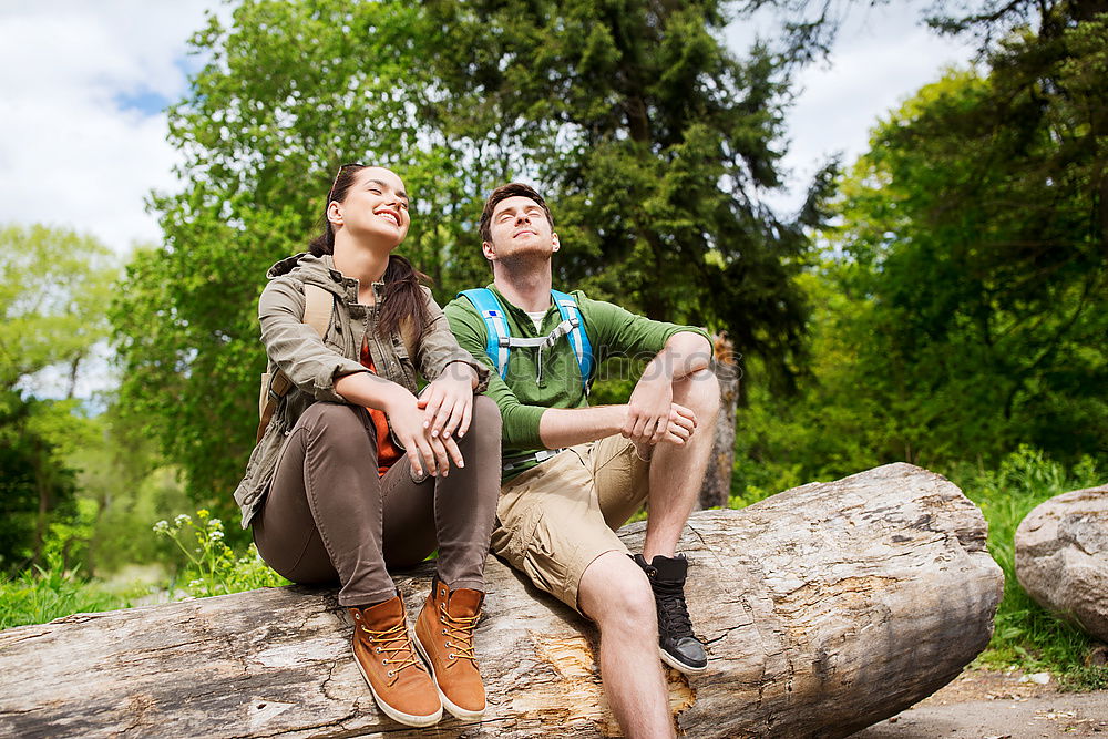 Similar – Image, Stock Photo Couple pausing while doing trekking