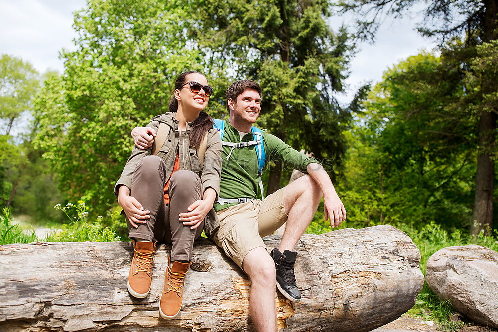 Similar – Image, Stock Photo Couple pausing while doing trekking