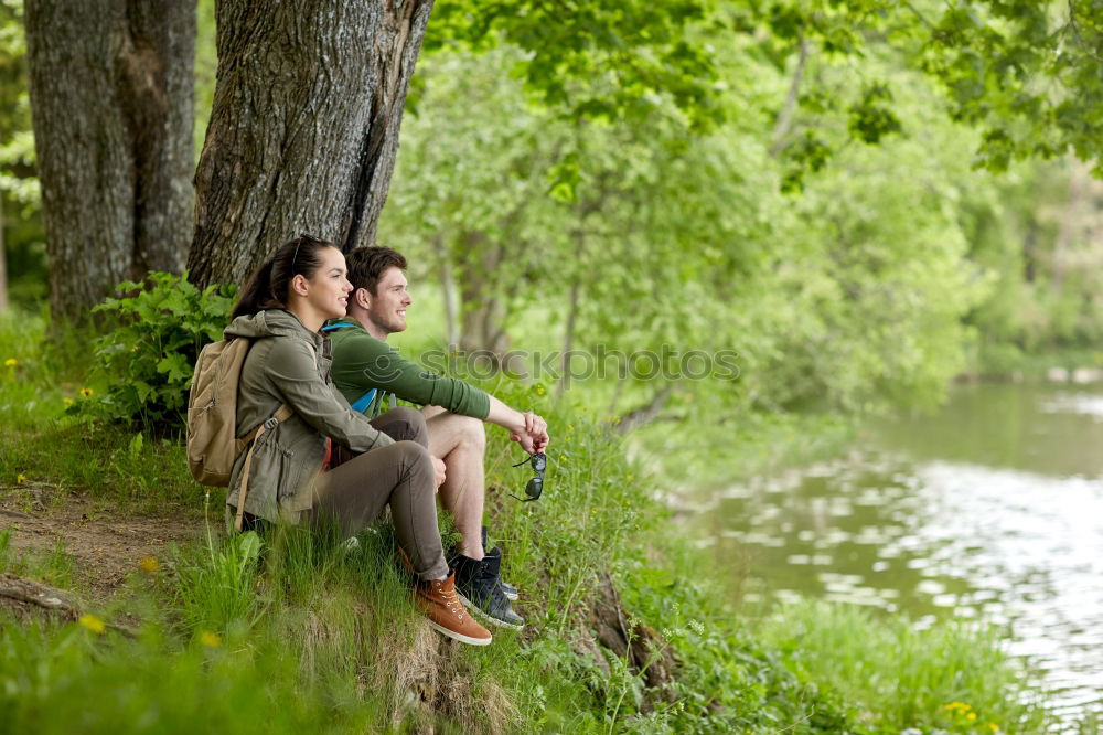 Similar – Image, Stock Photo Couple pausing while doing trekking