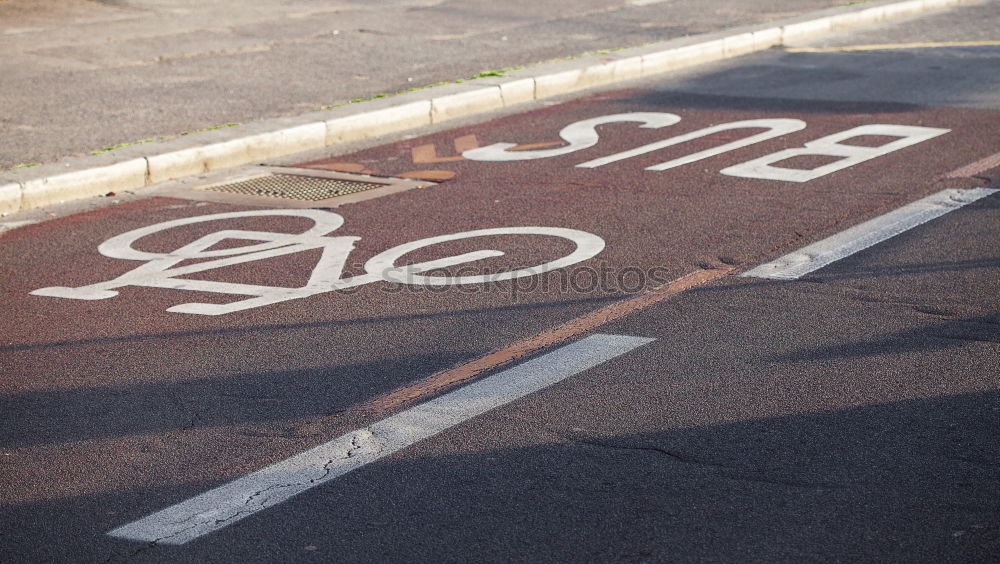 Similar – bike lane Asphalt Sidewalk