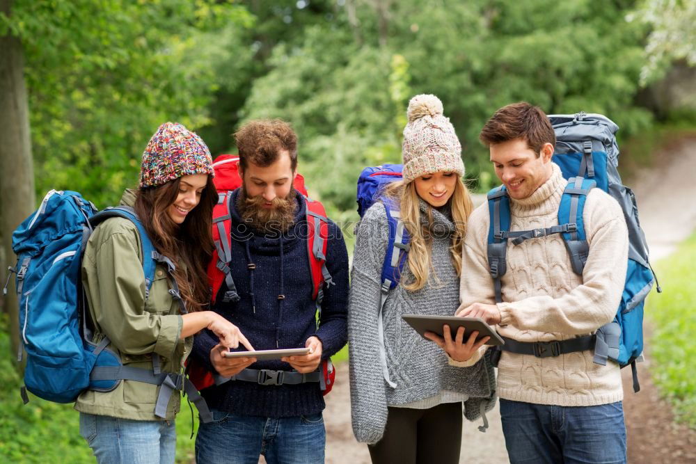Similar – Image, Stock Photo Couple doing trekking sitting looking mobile and map