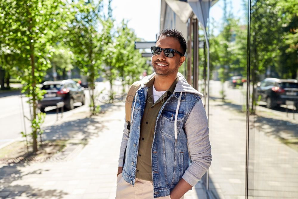 Similar – Afro young man using mobile phone and fixed gear bicycle.