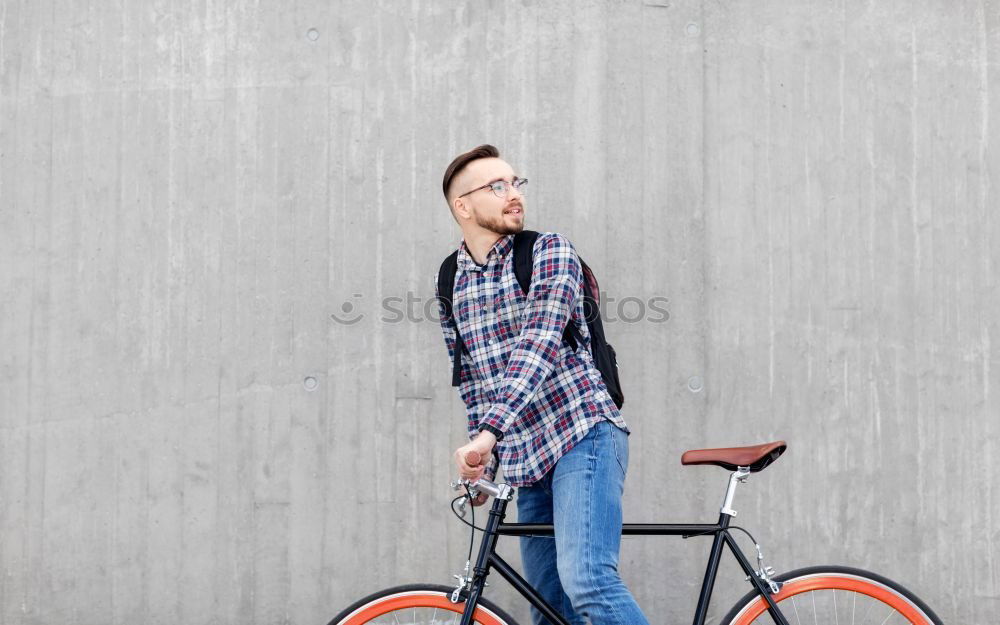 Similar – Sportlicher Mann mit Fahrrad beim Telefonieren