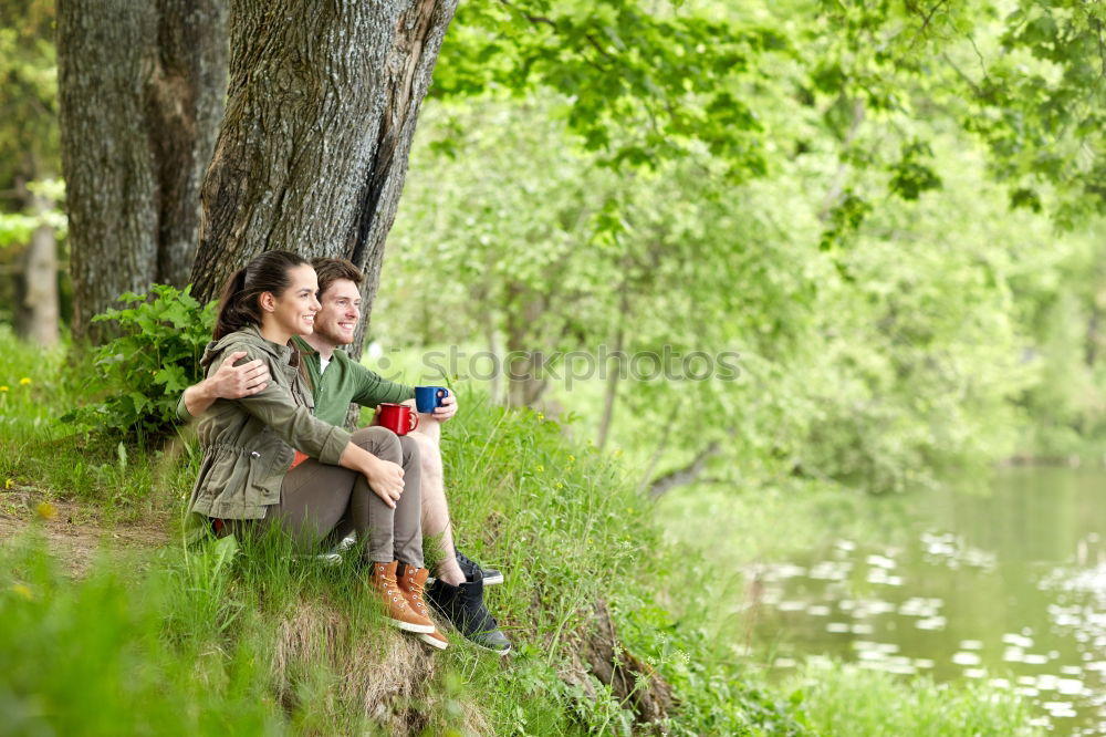 Similar – Image, Stock Photo Couple pausing while doing trekking