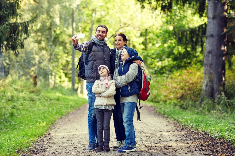 Similar – Family spending vacation time together having a snack sitting on jetty over the lake on sunny day in the summertime