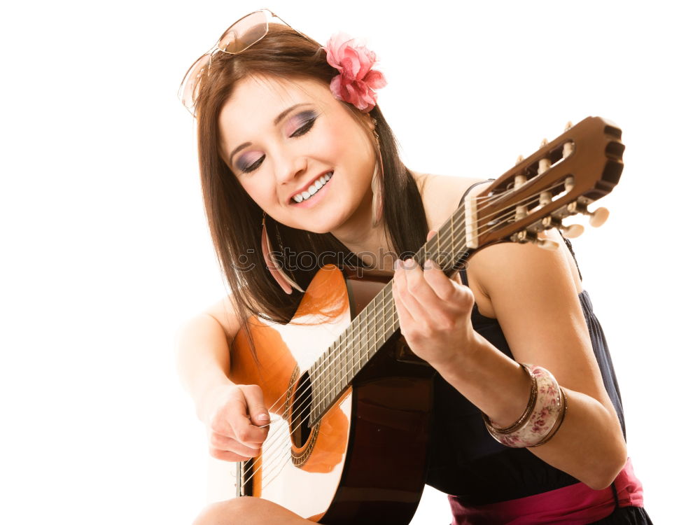 Similar – Beautiful woman playing guitar.