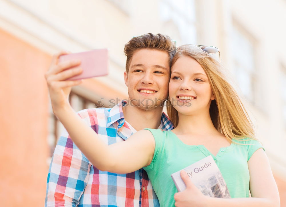 Similar – young cheerful couple taking a selfie