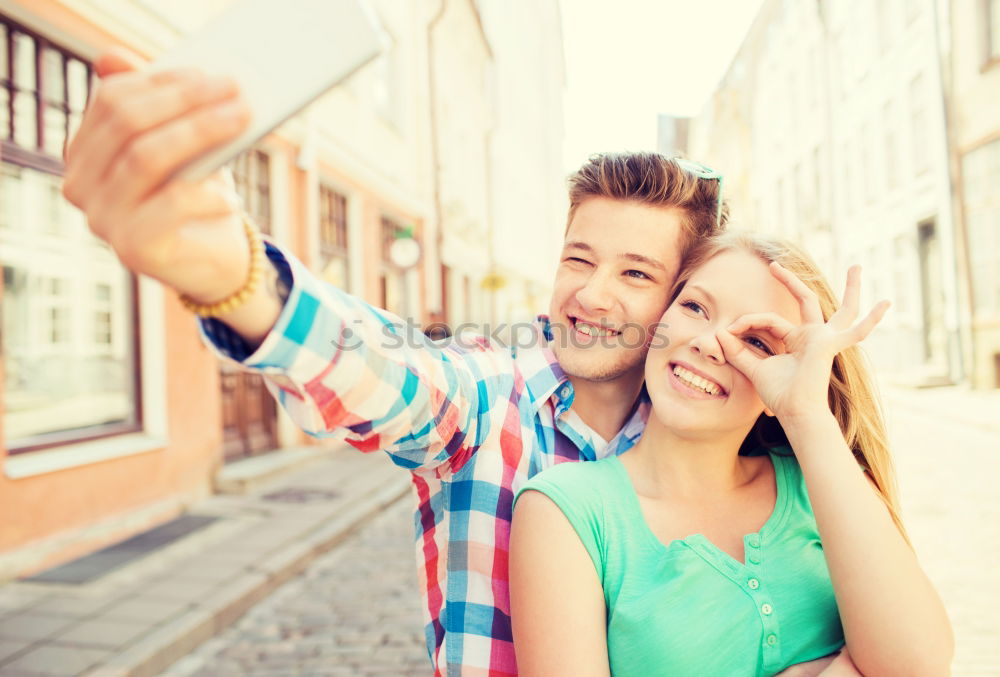 Similar – young cheerful couple taking a selfie